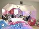 Large carpeted bedroom featuring colorful décor, grey walls and a ceiling fan at 941 W Barouche, Pendleton, IN 46064
