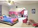 Spacious bedroom with rainbow decor, grey walls, carpet, ceiling fan and plenty of natural light at 941 W Barouche, Pendleton, IN 46064