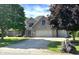 Charming two-story brick home featuring an attached two-car garage and a well-maintained lawn at 941 W Barouche, Pendleton, IN 46064