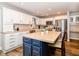 Bright kitchen with a large island, white cabinets, stainless steel appliances, and a built-in desk at 941 W Barouche, Pendleton, IN 46064