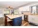 Bright kitchen with a large island, stainless steel appliances, modern countertops, and tile flooring at 941 W Barouche, Pendleton, IN 46064