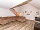 Inviting living room with a vaulted ceiling, wood floors, a fireplace, and a comfortable couch at 941 W Barouche, Pendleton, IN 46064