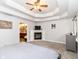 Spacious primary bedroom boasts a fireplace, tray ceiling, and ensuite bath access at 941 W Barouche, Pendleton, IN 46064