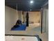 Unfinished basement with fitness equipment and open space; perfect for customization at 9879 Brightwater Dr, Fishers, IN 46038