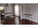 Dining room features wood floors, a chandelier and is staged with furniture at 9879 Brightwater Dr, Fishers, IN 46038