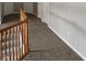 Hallway with neutral carpet and wooden banister at 9879 Brightwater Dr, Fishers, IN 46038