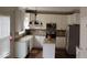 Kitchen featuring white cabinets, stainless steel appliances, and granite countertops at 9879 Brightwater Dr, Fishers, IN 46038