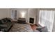 Cozy living room featuring a fireplace, comfortable seating, and natural light at 9879 Brightwater Dr, Fishers, IN 46038