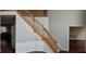 Grand staircase with wooden railing and trim; bright and spacious entryway at 9879 Brightwater Dr, Fishers, IN 46038