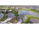 Aerial view of homes in a community, many of which feature lake views and manicured lawns at 991 Terra Ln, Franklin, IN 46131