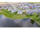 Aerial view showing the backyard of a home with a black fence and a pond view at 991 Terra Ln, Franklin, IN 46131