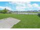 A grassy backyard bordered by a black fence, backing to a pond at 991 Terra Ln, Franklin, IN 46131