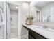 Bathroom featuring a granite countertop vanity, decorative floral arrangement, and open doorway to the bath/shower at 991 Terra Ln, Franklin, IN 46131