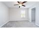 A brightly lit secondary bedroom with plush carpet and a ceiling fan at 991 Terra Ln, Franklin, IN 46131