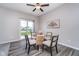 Elegant dining room with a glass table, stylish chairs, and a sliding door to the patio, perfect for entertaining at 991 Terra Ln, Franklin, IN 46131