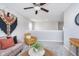 Upstairs loft with comfortable seating area, ceiling fan, natural light, and stylish decor for relaxing at 991 Terra Ln, Franklin, IN 46131