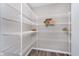 Well-organized pantry with ample shelving, offering plenty of storage space for all your culinary needs at 991 Terra Ln, Franklin, IN 46131