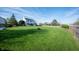 Expansive backyard with lush green lawn and privacy fence, ideal for recreation at 9910 Suncoral Cir, Fishers, IN 46038