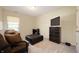 Inviting bedroom featuring a sofa, dresser, and a comfortable ottoman at 9910 Suncoral Cir, Fishers, IN 46038