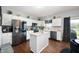 Bright kitchen featuring white cabinetry, stainless steel appliances, a center island, and modern countertops at 9910 Suncoral Cir, Fishers, IN 46038