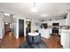 Well-lit kitchen connected to the dining area, showcasing white cabinets, a center island, and modern design at 9910 Suncoral Cir, Fishers, IN 46038