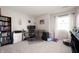 Well-lit home office with a large desk, bookshelves, and ample storage space at 9910 Suncoral Cir, Fishers, IN 46038