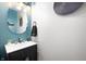 Stylish powder room with a modern vanity, elegant lighting, and sleek design at 9910 Suncoral Cir, Fishers, IN 46038