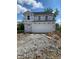 Two-story home featuring a large garage and covered in Barricade Building Wrap at 1041 Fuller Ln, Shelbyville, IN 46176