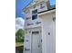 Close up of a two-story home featuring a white front door and Barricade Building Wrap at 1041 Fuller Ln, Shelbyville, IN 46176