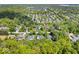 Aerial view of the home, showcasing the large lot and mature trees at 10444 Collingswood Ln, Fishers, IN 46037