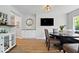 Elegant dining space with a round table, stylish chairs, and a wet bar nearby at 10444 Collingswood Ln, Fishers, IN 46037