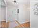Bright entryway with hardwood floors, white walls, and decorative accents at 10444 Collingswood Ln, Fishers, IN 46037