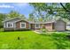 Charming single-story brick home with a well-manicured lawn and landscaping at 10444 Collingswood Ln, Fishers, IN 46037