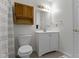 Neat bathroom with a single sink vanity and a toilet at 10616 Bartley Dr, Indianapolis, IN 46236