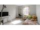 Bright bedroom with a desk, large window and comfortable bed at 10616 Bartley Dr, Indianapolis, IN 46236