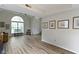 Open-concept living room with abundant natural light, and modern floors, creating an inviting space at 10616 Bartley Dr, Indianapolis, IN 46236