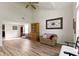 Open living room featuring vaulted ceilings, wood-look floors, and ample natural light at 10616 Bartley Dr, Indianapolis, IN 46236