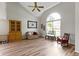 Spacious living room with high ceilings, large arched window, and modern flooring at 10616 Bartley Dr, Indianapolis, IN 46236