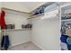 Walk-in closet with shelves and rods for organized storage at 10616 Bartley Dr, Indianapolis, IN 46236