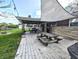 Back deck featuring a picnic table and a covered patio with outdoor seating and sunshade at 10751 N Kitchen Rd, Mooresville, IN 46158
