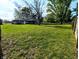 A sprawling backyard with a covered patio and mature trees at 10751 N Kitchen Rd, Mooresville, IN 46158