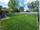 An expansive backyard features a fire pit and lots of space for outdoor activities and relaxation at 10751 N Kitchen Rd, Mooresville, IN 46158