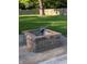 A cozy brick fire pit, perfect for outdoor entertaining and relaxation at 10751 N Kitchen Rd, Mooresville, IN 46158