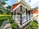 Inviting covered front porch with stylish railing and well-maintained landscaping at 10751 N Kitchen Rd, Mooresville, IN 46158