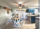 Inviting eat-in kitchen with island, tile floor, and stylish cabinets at 10751 N Kitchen Rd, Mooresville, IN 46158