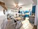 Charming eat-in kitchen with stylish blue cabinets, updated fixtures, and tile floors at 10751 N Kitchen Rd, Mooresville, IN 46158