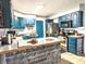 Well-equipped kitchen with stainless steel appliances and wood-finished island at 10751 N Kitchen Rd, Mooresville, IN 46158