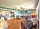Spacious living room featuring hardwood floors and an open layout to the kitchen at 10751 N Kitchen Rd, Mooresville, IN 46158