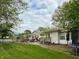 Spacious backyard with pool, seating, and trampoline at 10946 Maze Rd, Indianapolis, IN 46259