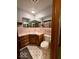 This charming bathroom is furnished with a toilet, corner sink, mirror, and tile flooring at 10946 Maze Rd, Indianapolis, IN 46259